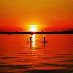 Paddleboarders at Sunset in Sandbanks