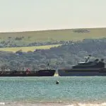 Boats at Sandbanks with a jurassic backdrop