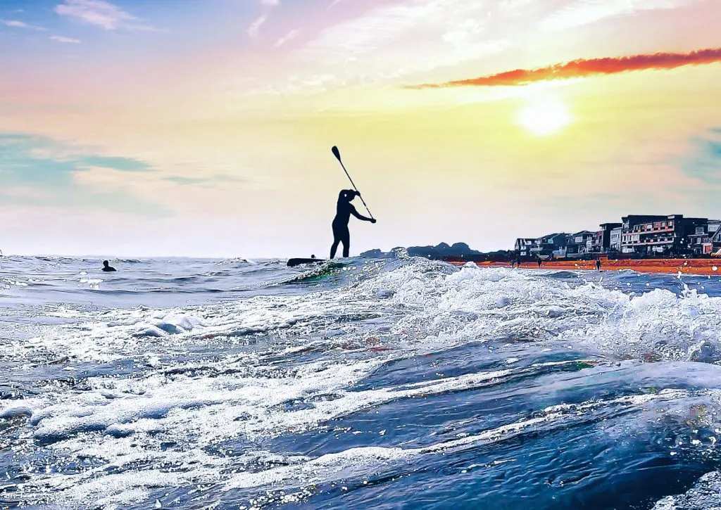 Paddleboarder at sunset