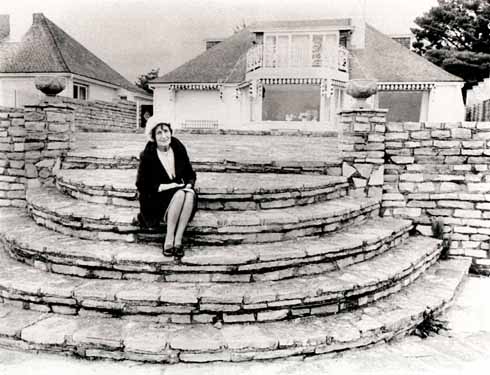 Mimi Smith, John Lennon's aunt, on the steps of her house in Sandbanks