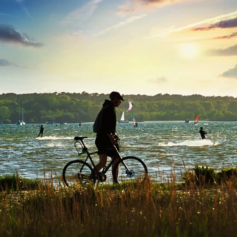 Biker silhouette with Brownsea Island as a backdrop