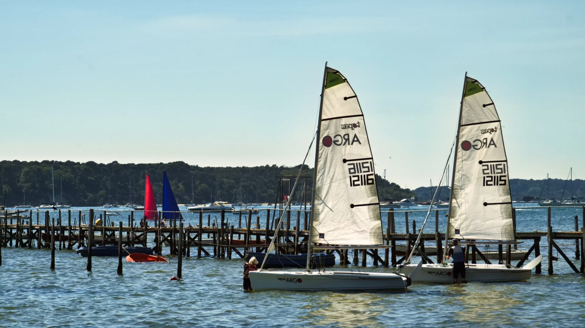 Two yachts prepare at Sandbanks