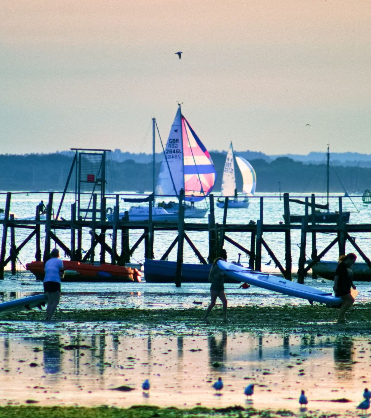 Sandbanks Paddleboarders with Boats & Brownsea