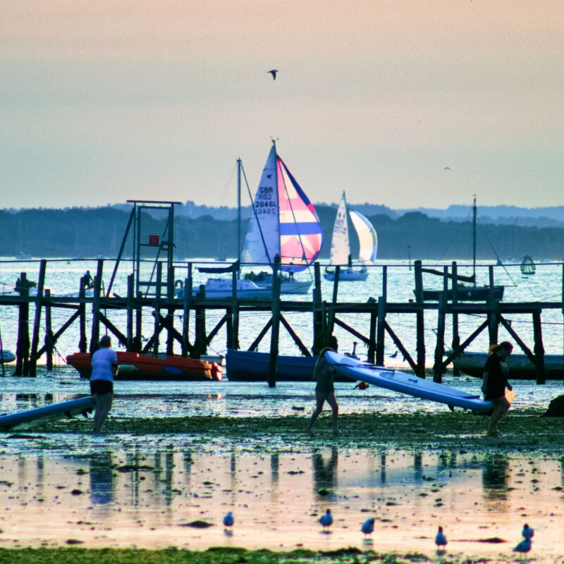 Sandbanks Paddleboarders with Boats & Brownsea
