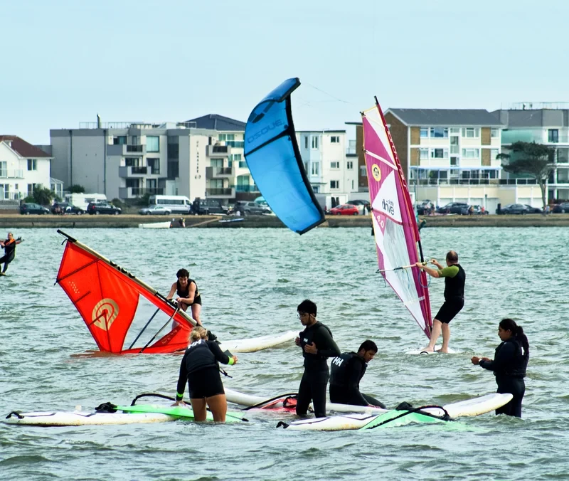 Windsurfers at Sandbanks with a view of the famous Peninsula